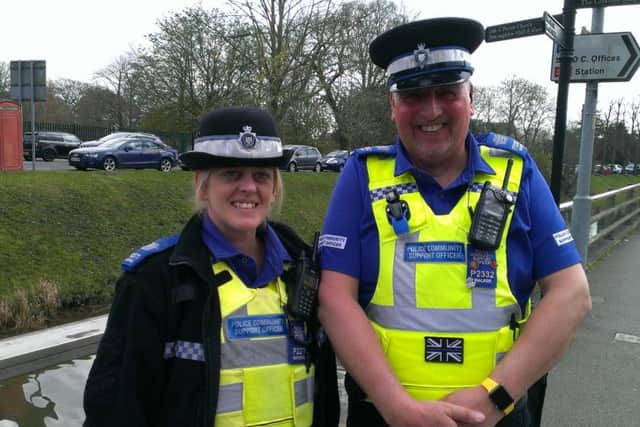 PCSOs Lisa Waterfall and Dave Walker pictured on the riverside after completing their duck rescue mission. ANL-160413-151859001