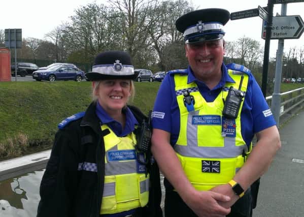PCSOs Lisa Waterfall and Dave Walker pictured on the riverside after completing their duck rescue mission. ANL-160413-151859001
