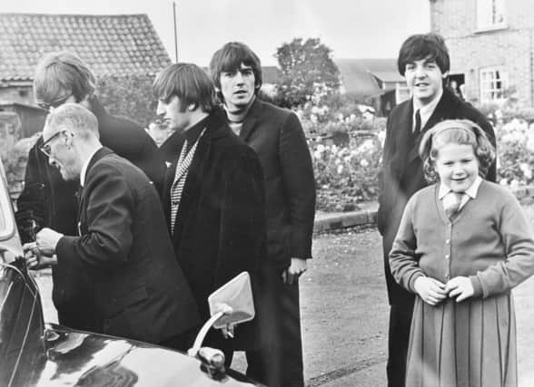 Vivien Stevenette of Werrington with her Beatles photographs EMN-160413-133630009