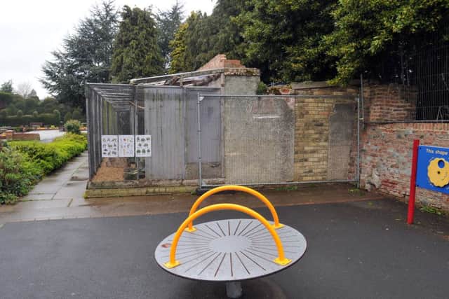 Wire fencing has been erected to prevent access to the roof of the aviary.