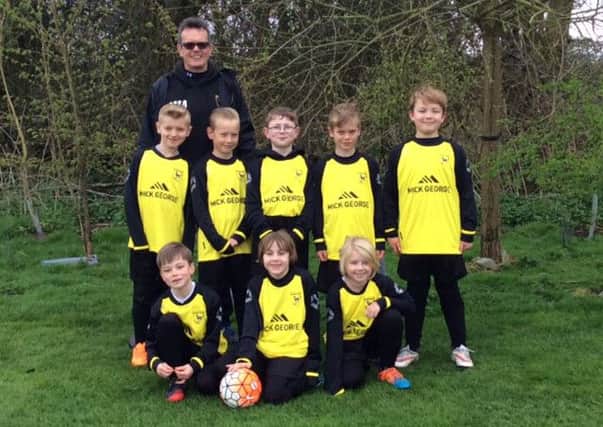 Ramsey Colts Stallions Under 8s in new kit supplied by Mick George Ltd.