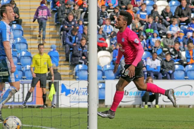 Shaquile Coulthirst of Peterborough United celebrates scoring his side's third goal. Picture: Joe Dent