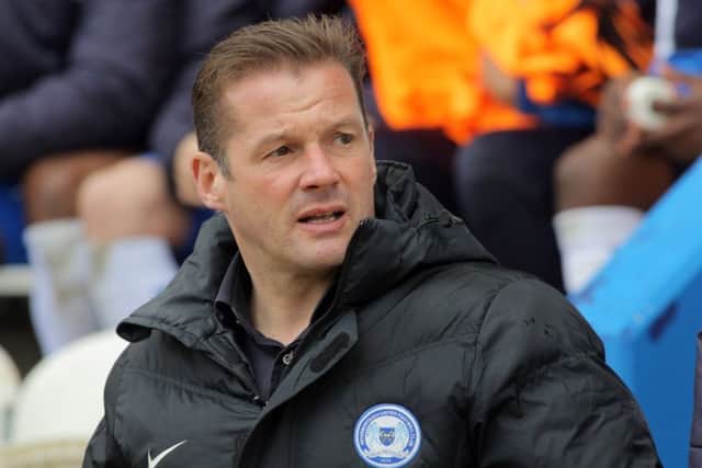 Posh manager Graham Westley watches his side battel their way to a 4-1 win at Colchester. Photo: Joe Dent/JMP.