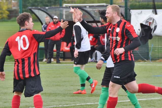 Ian Dunn (right) celebrates his goal for Pinchbeck against Netherton. Photo: David Lowndes.