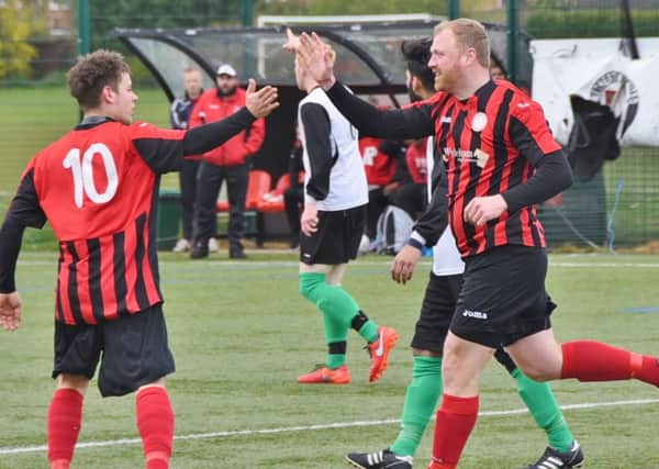 Ian Dunn (right) celebrates his goal for Pinchbeck against Netherton. Photo: David Lowndes.