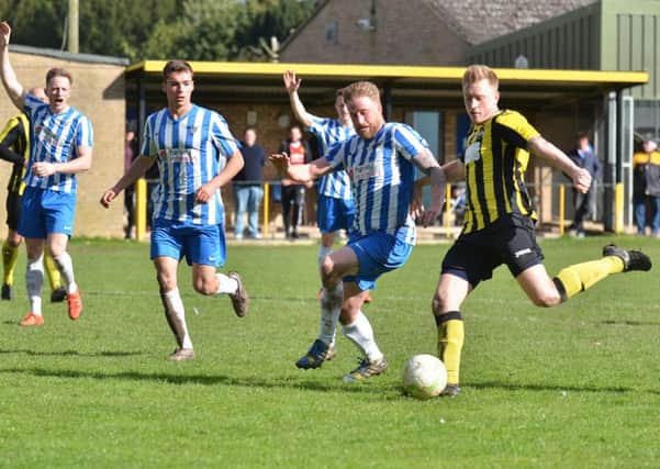 Action from Holbeach United's defeat at the hands of Eynesbury. Photo: Tim Wilson.