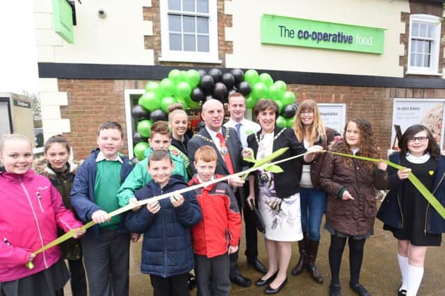 Opening of the new Co-operative store at The High Street, Eye. Pictured are Mayor Cllr John Peach and Mayoress Janet Martin with staff at the store and pupils and staff from Eye C of E Primary School.