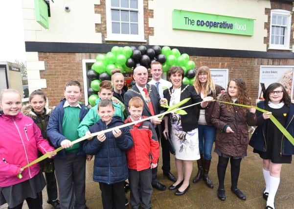 Opening of the new Co-operative store at The High Street, Eye. Pictured are  Mayor Cllr John Peach and Mayoress Janet Martin with staff at the store and pupils and staff from Eye C of E Primary School.