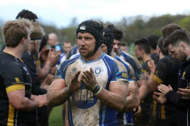 Chris Humphrey leads the Lions off the pitch for the last time. Picture: Mick Sutterby