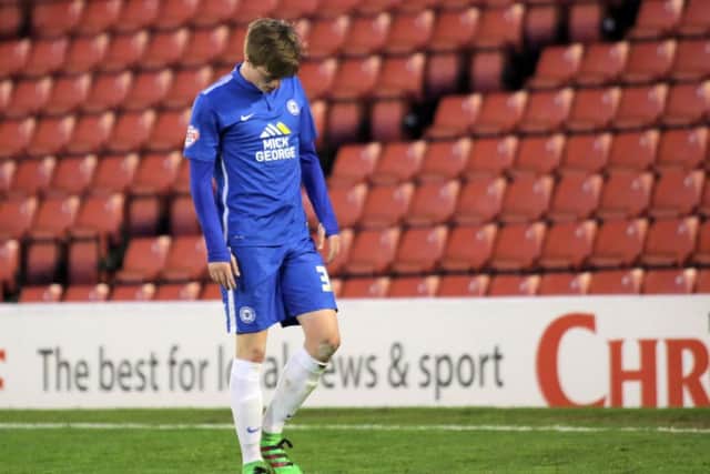 Posh midfielder Chris Forrester takes the long walk of shame after being sent off at Barnsley. Photo: Joe Dent/theposh.com.
