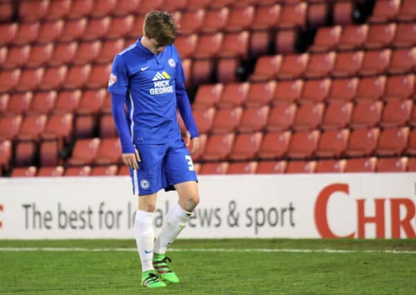 Posh midfielder Chris Forrester takes the long walk of shame after being sent off at Barnsley. Photo: Joe Dent/theposh.com.