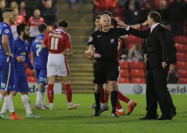 Posh boss Graham Westley has words with referee Michael Bull after Chris Forrester is sent off. Photo: Joe Dent/theposh.com.