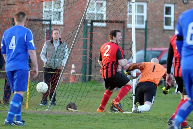 Pinchbeck equalise against Moulton Harrox. Photo: Tim Wilson.