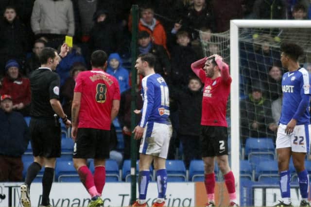 Michael Smith collects his second yellow card of the game at Chesterfield. Photo: Joe Dent/theposh.com.
