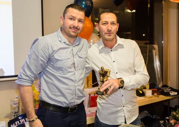 Ales Padelek (left) is presented with an award by Rob Clark of Sovereign Installations. Picture: Tom Scott