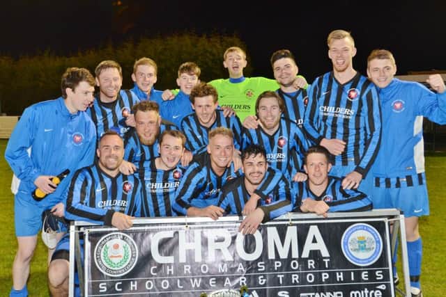Whittlesey Athletic C celebrate their Peterborough League Shield Final success.
