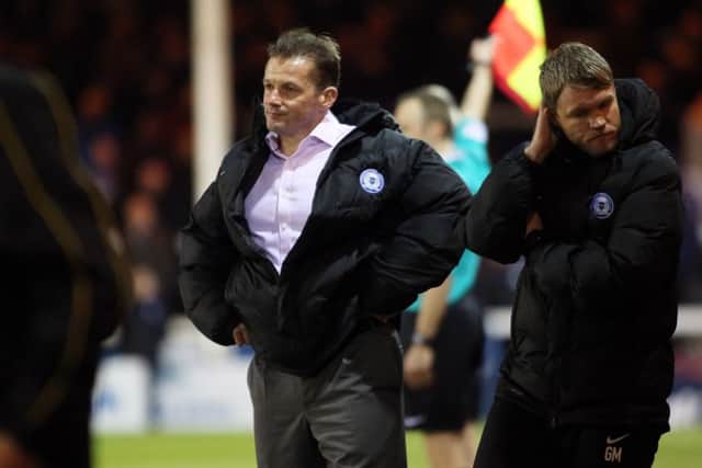 Graham Westley, pictured on the left of new caretaker-manager Grant McCann, lasted 215 days as Posh manager. Photo: Joe Dent/theposh.com.