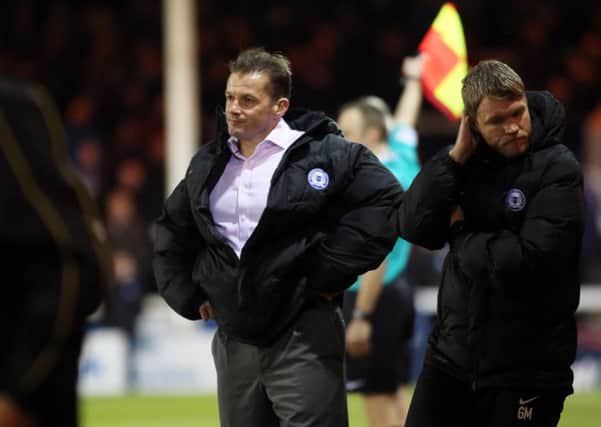 Graham Westley, pictured on the left of new caretaker-manager Grant McCann, lasted 215 days as Posh manager. Photo: Joe Dent/theposh.com.
