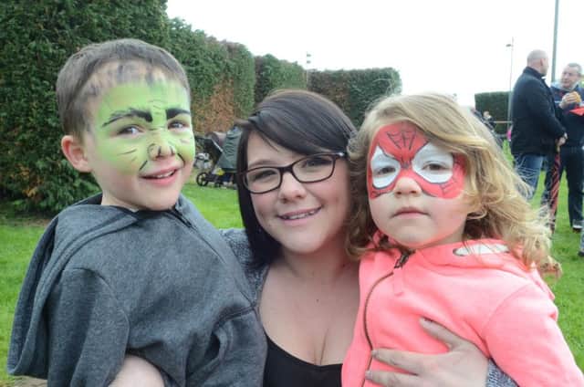 Skin cancer sufferer  Sian Clarkson at a fundraising day in Yaxley. Also pictured is her daughter  Belle (4) and son Josh (5) EMN-160423-172557009