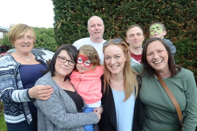 Skin cancer sufferer  Sian Clarkson at a fundraising day in Yaxley. She is pictured with members of her family EMN-160423-172614009