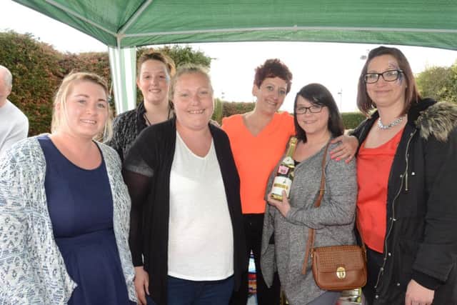 Skin cancer sufferer  Sian Clarkson at a fundraising day in Yaxley. She is pictured with fundraisers  Natalie Handley, Toni Stimpson, Erica Gee, Rachel Cox and Rebecca Mott EMN-160423-172640009