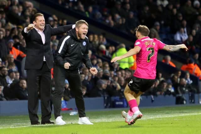 Grant McCann celebrates a Posh goal at West Brom earlier this season. Photo: Joe Dent/theposh.com.
