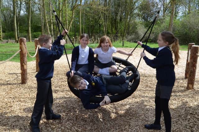 Pupils from KS2 at St Botolph's C of E school trying out the new play area facility at Ferry Meadows EMN-160427-152916009