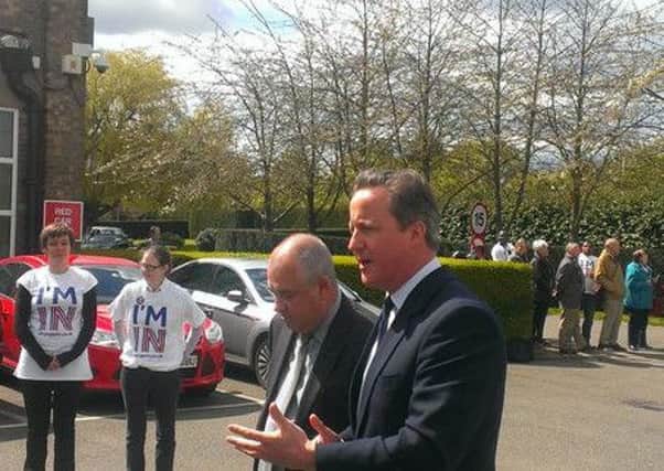 Prime Minister David Cameron arriving in Peterborough