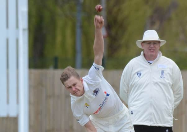David Sayer bowling for Peterborough Town against Wollaston.