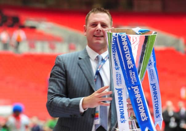 Posh chairman Darragh Macanthony with the Johnstone's Paint Trophy at Wembley.