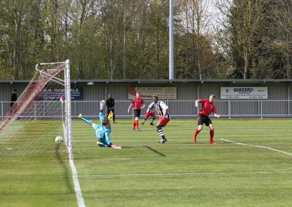 Jezz Goldson-Williams scores for Peterborough Northern Star at Sileby. Photo: Tim Gates.
