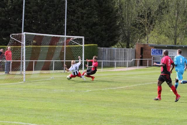Craig Smith scores for Peterborough Northern Star at Sileby. Photo: Tim Gates.