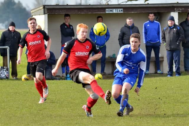 Herbie Panting (red) scofred twice for Netherton United against Langtoft United.
