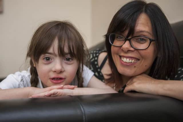 Mum Karen with Lucy Harris. Mum has created a petition on about school attendance figures and rewards.,
Home, Peterborough
03/05/2016.
Picture by Terry Harris. THA