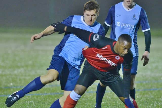 Dwayne Rankin (red) came closest to scoring for Netherton at Whittlesey.