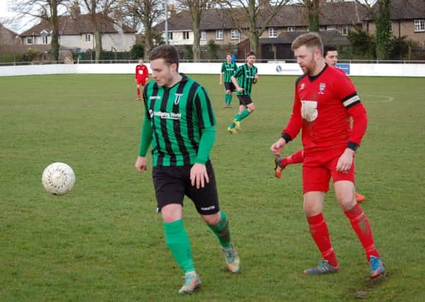 Scott Ginty (green) scored a great goal for Blackstones in the Lincs Senior Trophy Final.