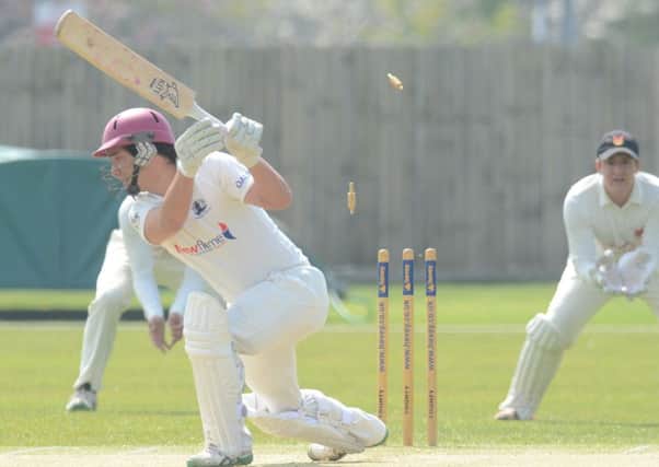 Peterborough Town skipper David Clarke is bowled by Oundle's Jack Roberts. Photo: David Lowndes.