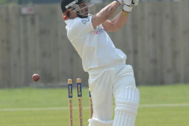 Peterborough Town's Asim Butt is bowled by Oundle's Jack Roberts. Photo: David Lowndes.