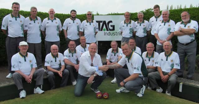 Whittlesey Manor team members are pictured in their new bowls shirts sponsored by TAG Industries, whose owner, Sam Cowan (kneeling left), officially presented them to club president Martin Welsford before the annual match against the Northants Bowling Federation on Saturday.