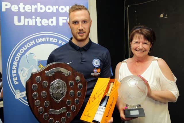 Marcus Maddison with his player-of-the-year prize.