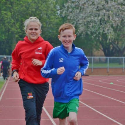 Brandon Ballard pictured with coach Abi Schofield.