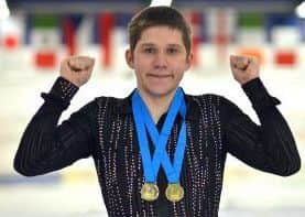 Calum Titmus with two gold medals he won last month in Glasgow.