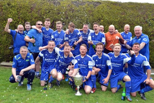 Moulton Harrox celebrate their Premier Division title win.