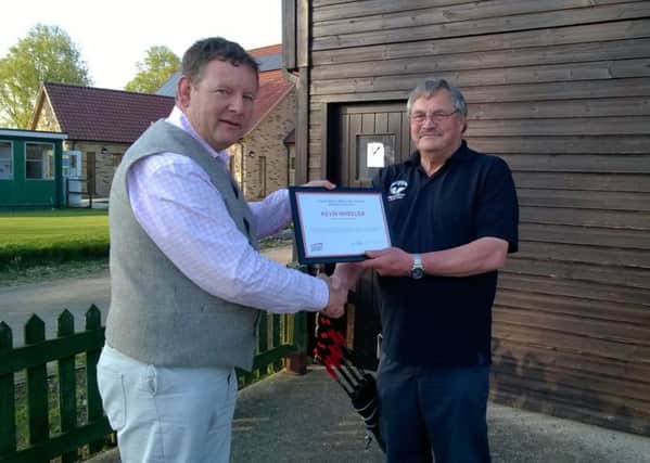 Kevin Wheeler receives his award from Living Sport's Simon Fairhall.