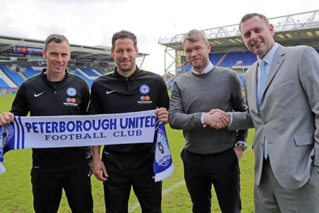 Posh chairman Darragh MacAnthony with most of his new management team, from left, David Farrell, Mark Tyler and Grant McCann. Photo: Joe Dent/theposh.com.