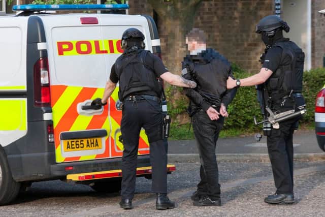 Image ©Licensed to i-Images Picture Agency. 17/05/2016. Peterborough, United Kingdom. Armed MET Police raid an address and arrest a male.. Picture by Terry Harris / i-Images