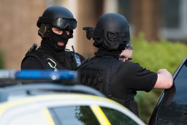 Image ©Licensed to i-Images Picture Agency. 17/05/2016. Peterborough, United Kingdom. Armed MET Police raid an address and arrest a male.. Picture by Terry Harris / i-Images