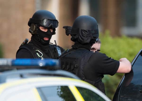 Image Â©Licensed to i-Images Picture Agency. 17/05/2016. Peterborough, United Kingdom. Armed MET Police raid an address and arrest a male.. Picture by Terry Harris / i-Images
