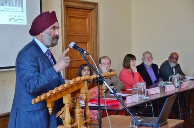 Peterborough Inter-Faith Council Faith Festival and Food at Peterborough Town Hall. Chairman Dr Jaspal Singh speaking EMN-160515-160400009