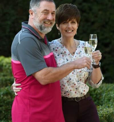 Gerry Cannings, 63, and his wife Lisa, 48, from near Peterborough, Cambridgeshire, celebrate at the city's Orton Hall Hotel after winning a Â£32.5 million rollover Lotto jackpot.  PRESS ASSOCIATION Photo. EMN-160224-144502001